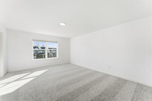 (Photo of a similar home, actual finishes may vary) Abundant natural light streams in from the large windows