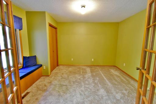 Freshly carpeted room can be used as a bedroom, a great office, play area or library