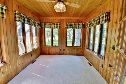 Sunroom area just off the kitchen makes a great place for morning coffee