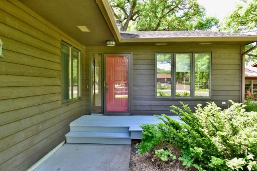 Front deck area makes a nice place to visit with your neighbors and a beautiful entry area