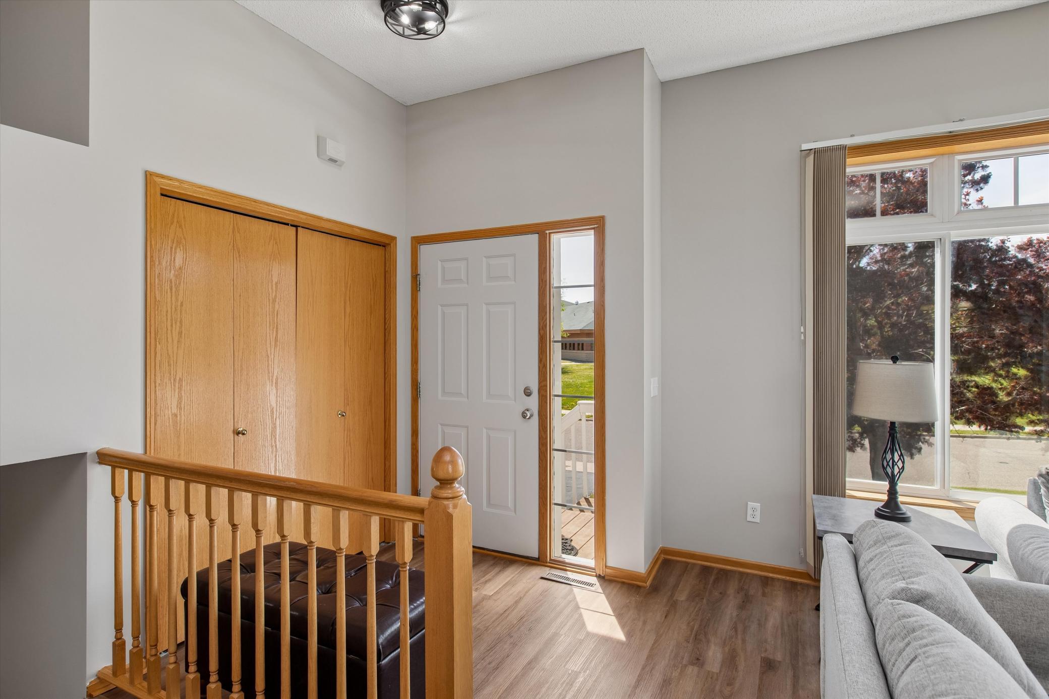 Bright open foyer- spacious coat closet