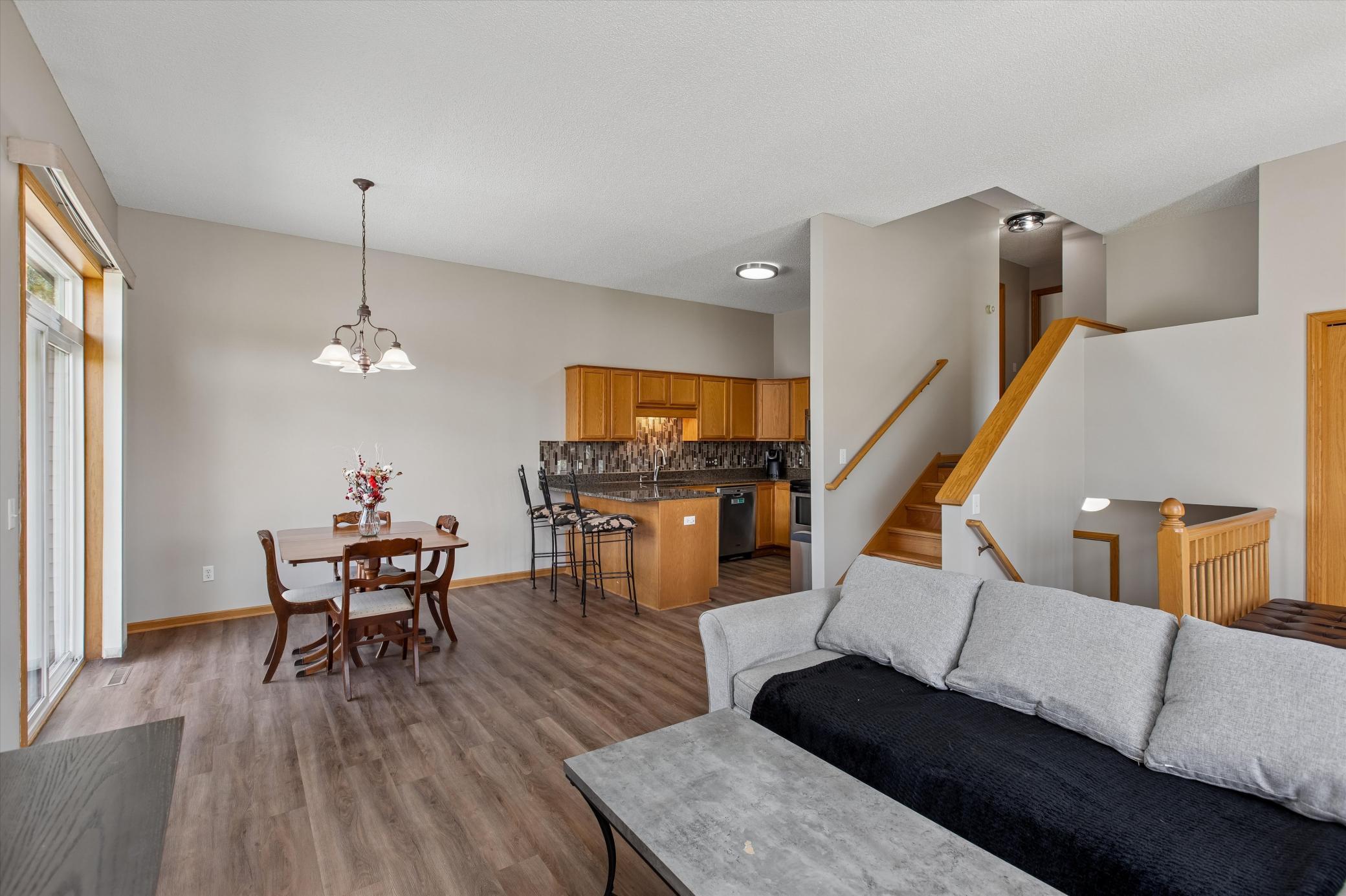 Vinyl plank flooring runs through the main level