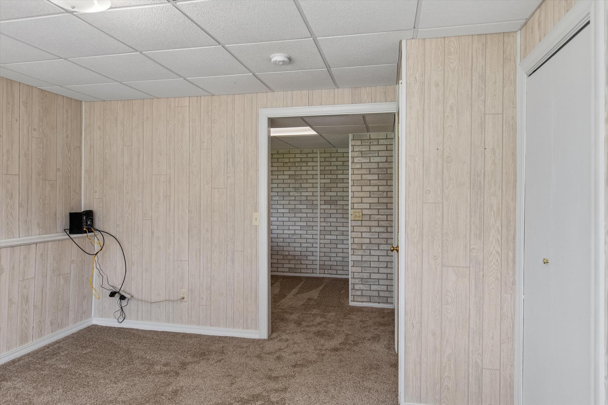 Lower level family room leads to 3rd bedroom