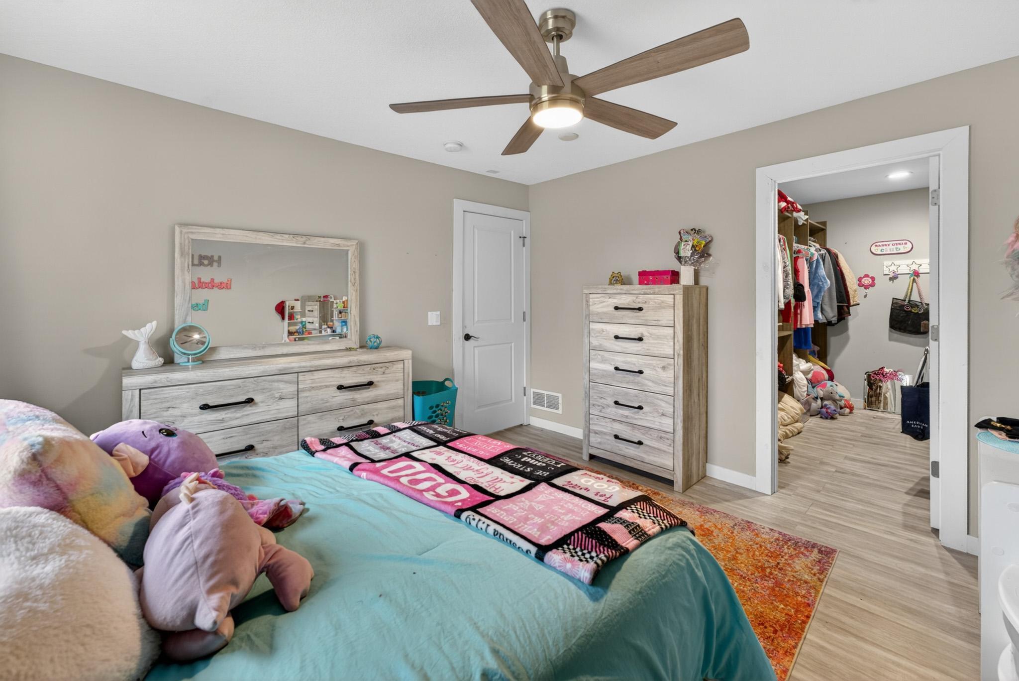 Lower level primary bedroom with walk in closet