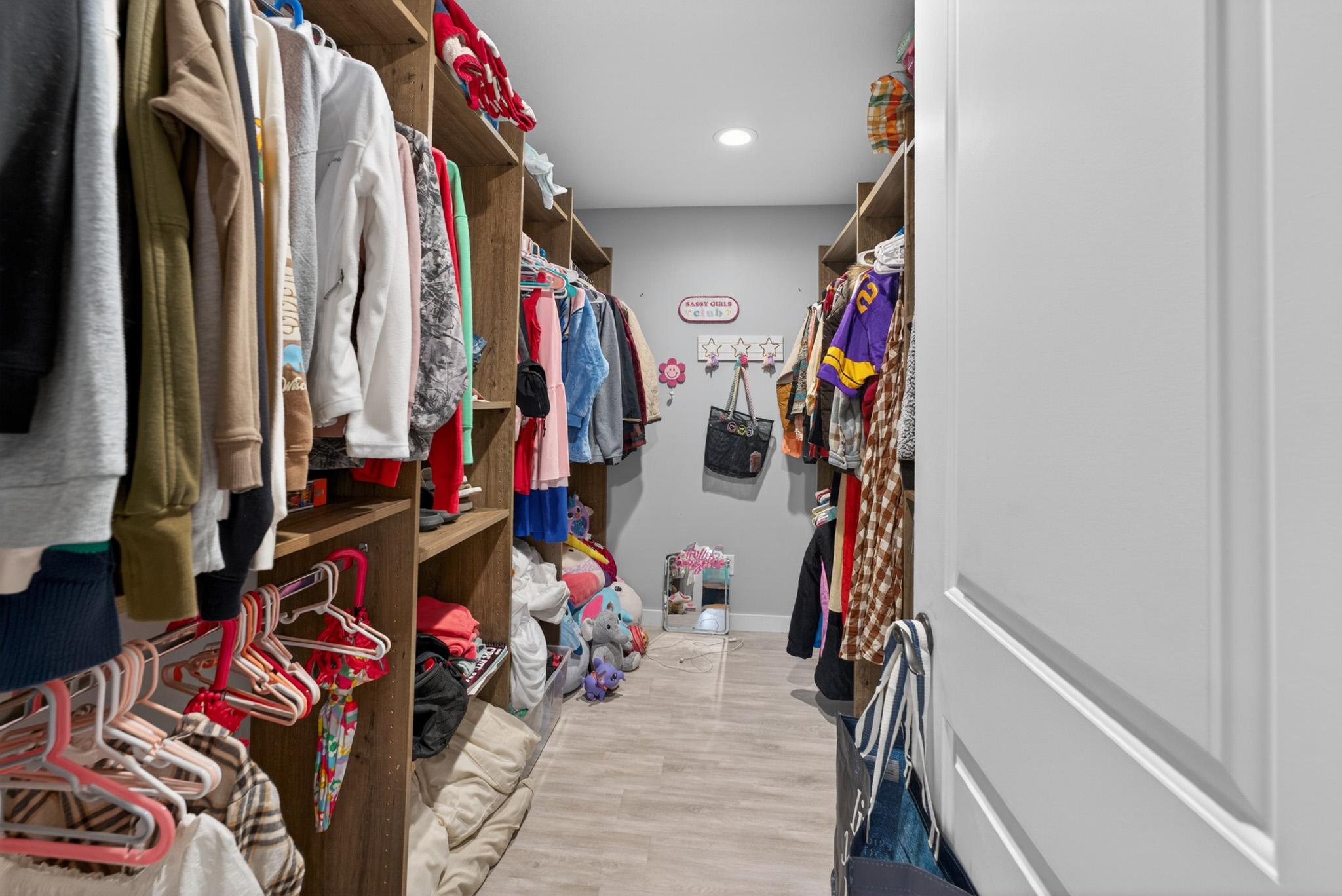 Primary bedroom walk in closet