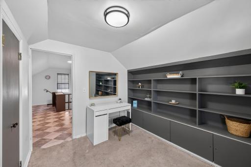 Custom built-ins and generous storage make this the perfect office, studio, or hobby room.
