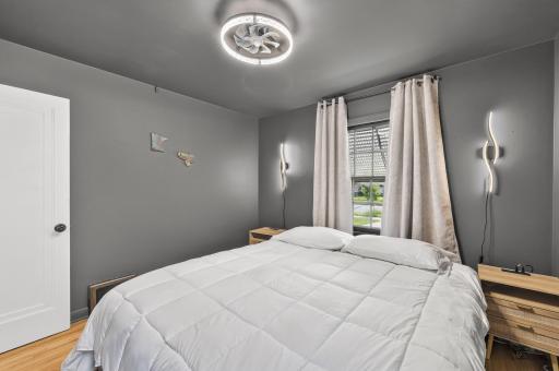 Moody color-drenched walls, hardwood floors, and natural light combine to create a luxurious atmosphere.