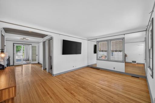 Spacious gathering space with an effortless flow into the dining area and sunroom.