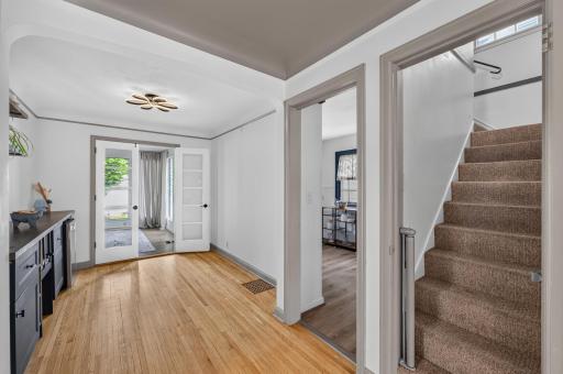 Warm and inviting entryway showcasing the home's original charm.