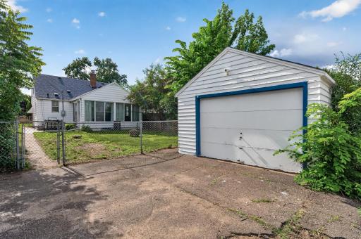 Detached garage and additional parking provide convenience and functionality.