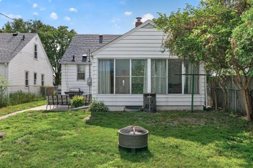 The temperature-controlled four-season sunroom creates year-round living space filled with natural light..jpg