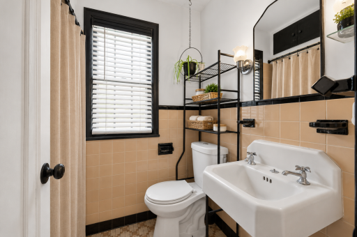 Classic charm meets everyday functionality in the home's full bath.