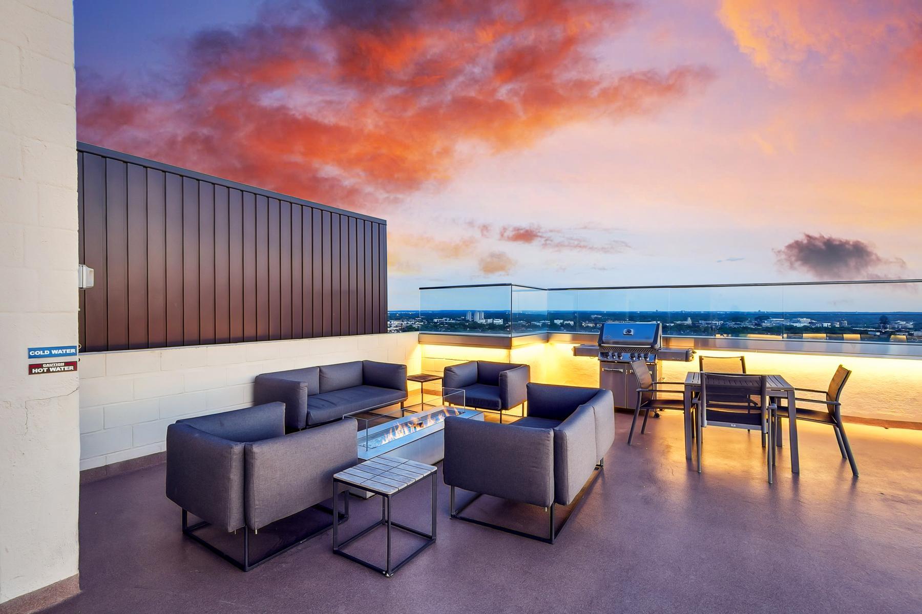400 Rooftop seating in the evening with firepit.jpg