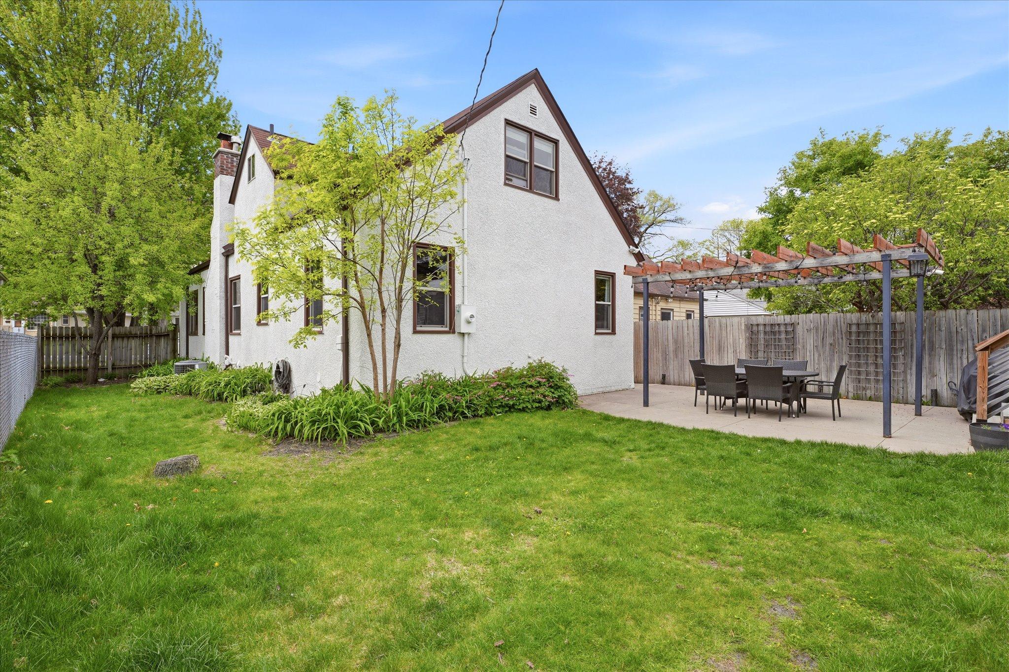 Fenced Rear yard offers greenspace & privacy