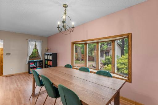 Large dining room space with bay window to backyard