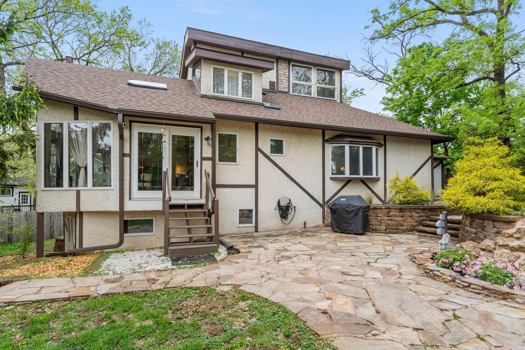 Large stone patio steps away from the family room
