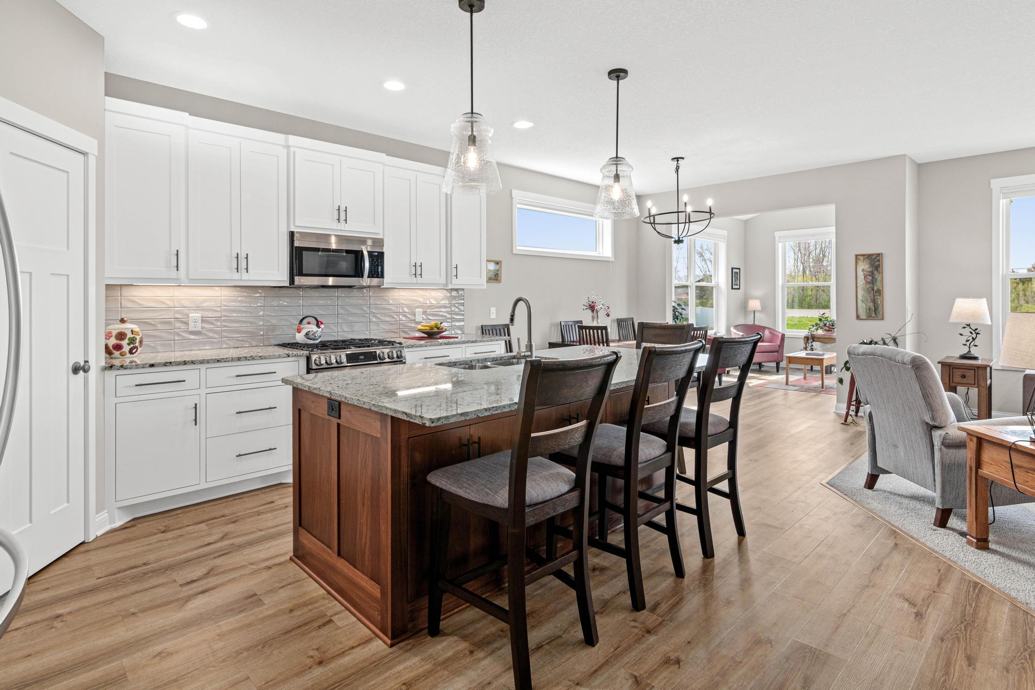 Floor plan flows easily between kitchen, dining room, living room and sun room.
