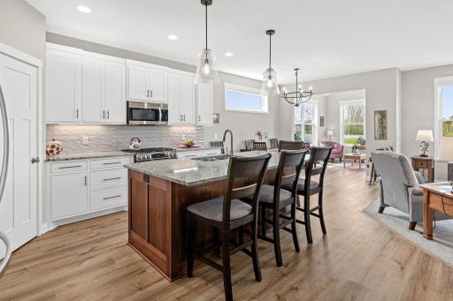 Floor plan flows easily between kitchen, dining room, living room and sun room.