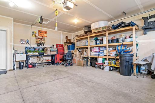 Two car heated garage includes a utility sink and a floor drain to wash away the slush from your cars.