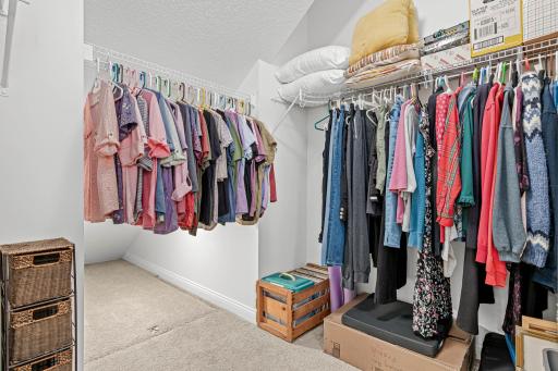 Spacious walk-in closet in primary suite