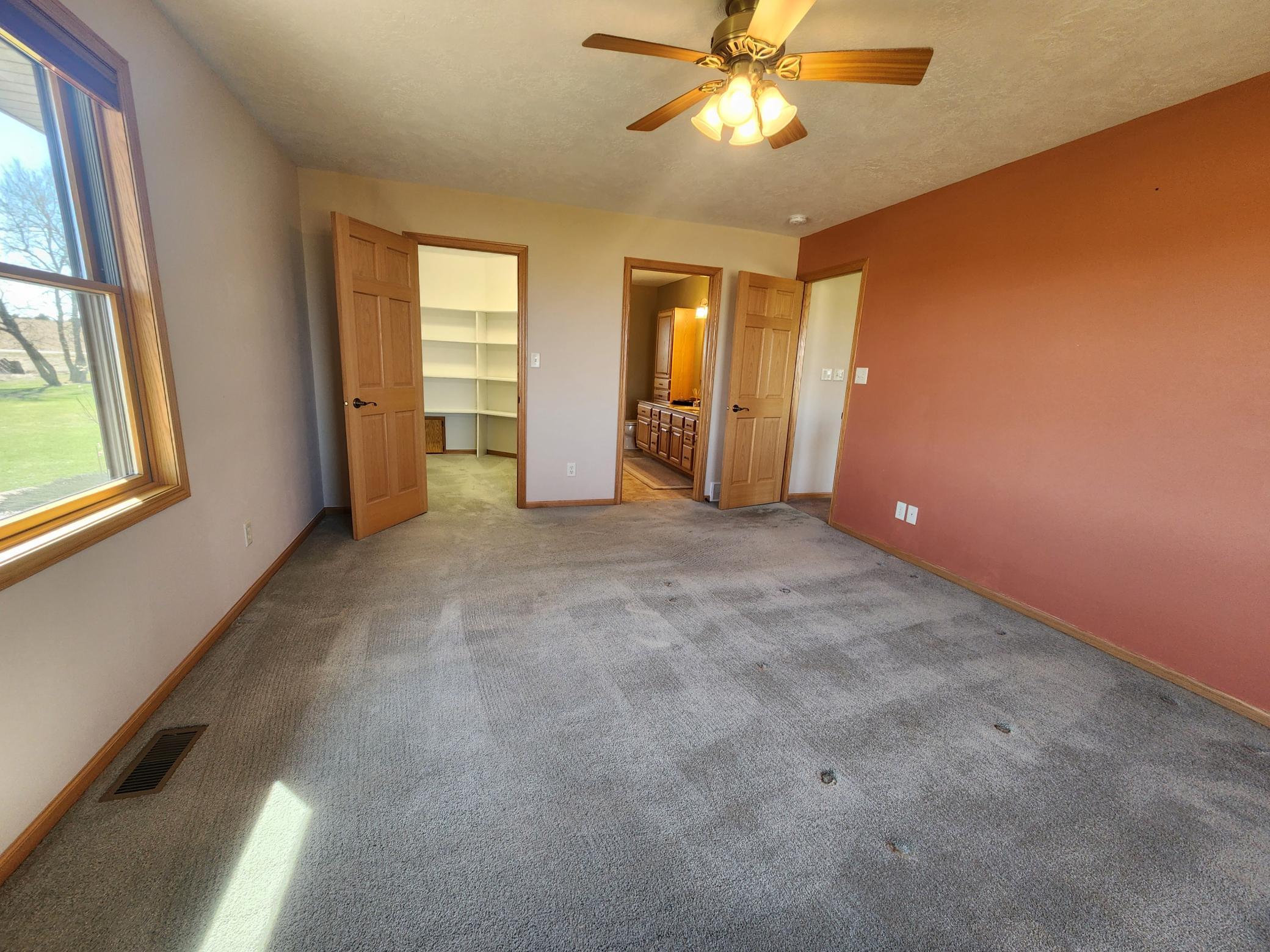 Primary bedroom with walk-in closet and ensuite