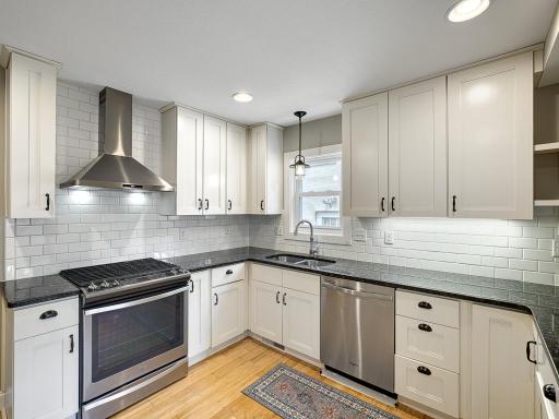 Attractive counter to ceiling tile backsplash make this a stylish area for cooking and entertaining.