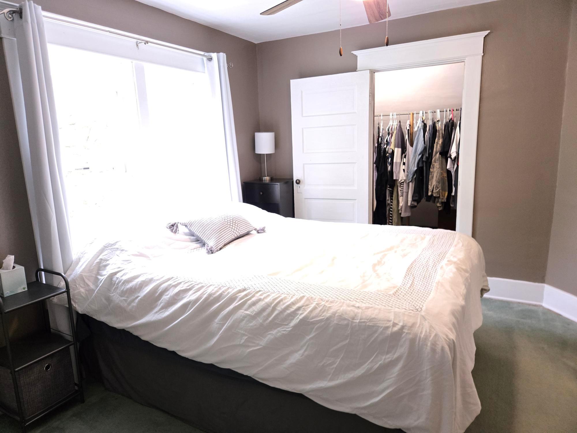 Another view of Primary bedroom with walk in closet