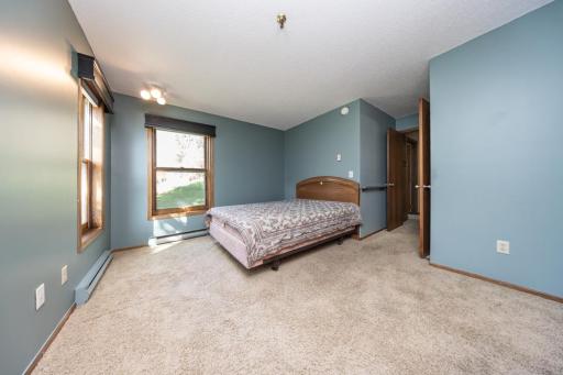 Very large primary bedroom suite features a private bathroom and two closets