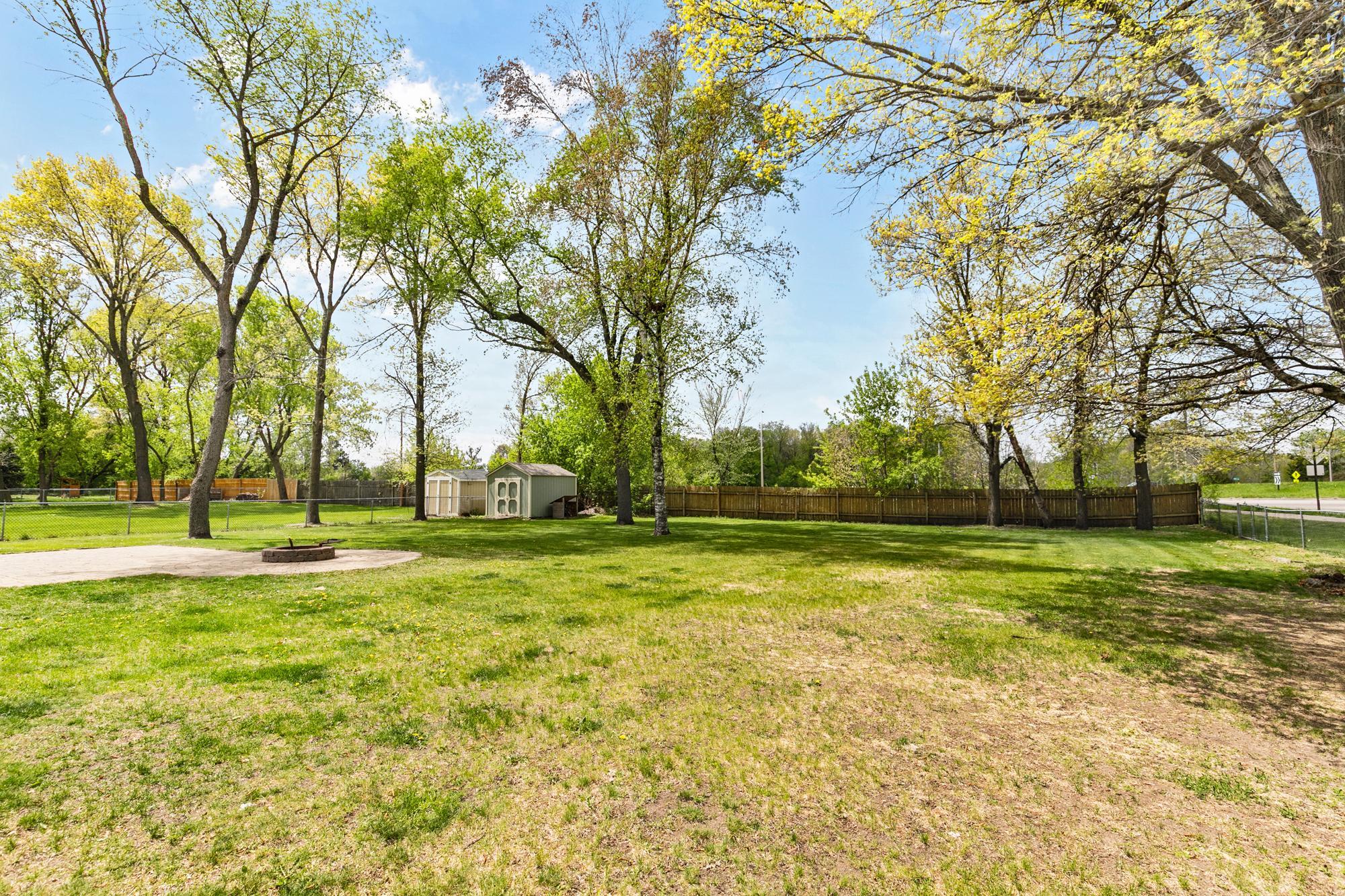 Huge fenced in yard with rear shed