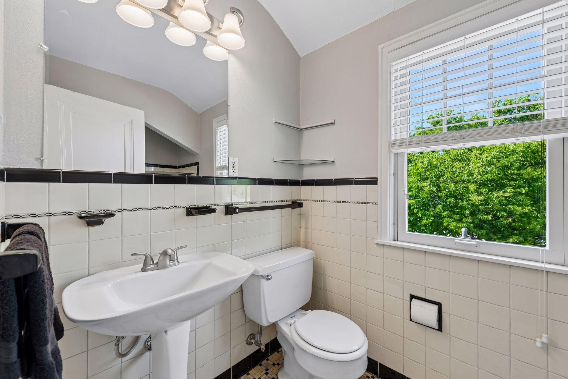 Bright and sunny upstairs bath with original tile