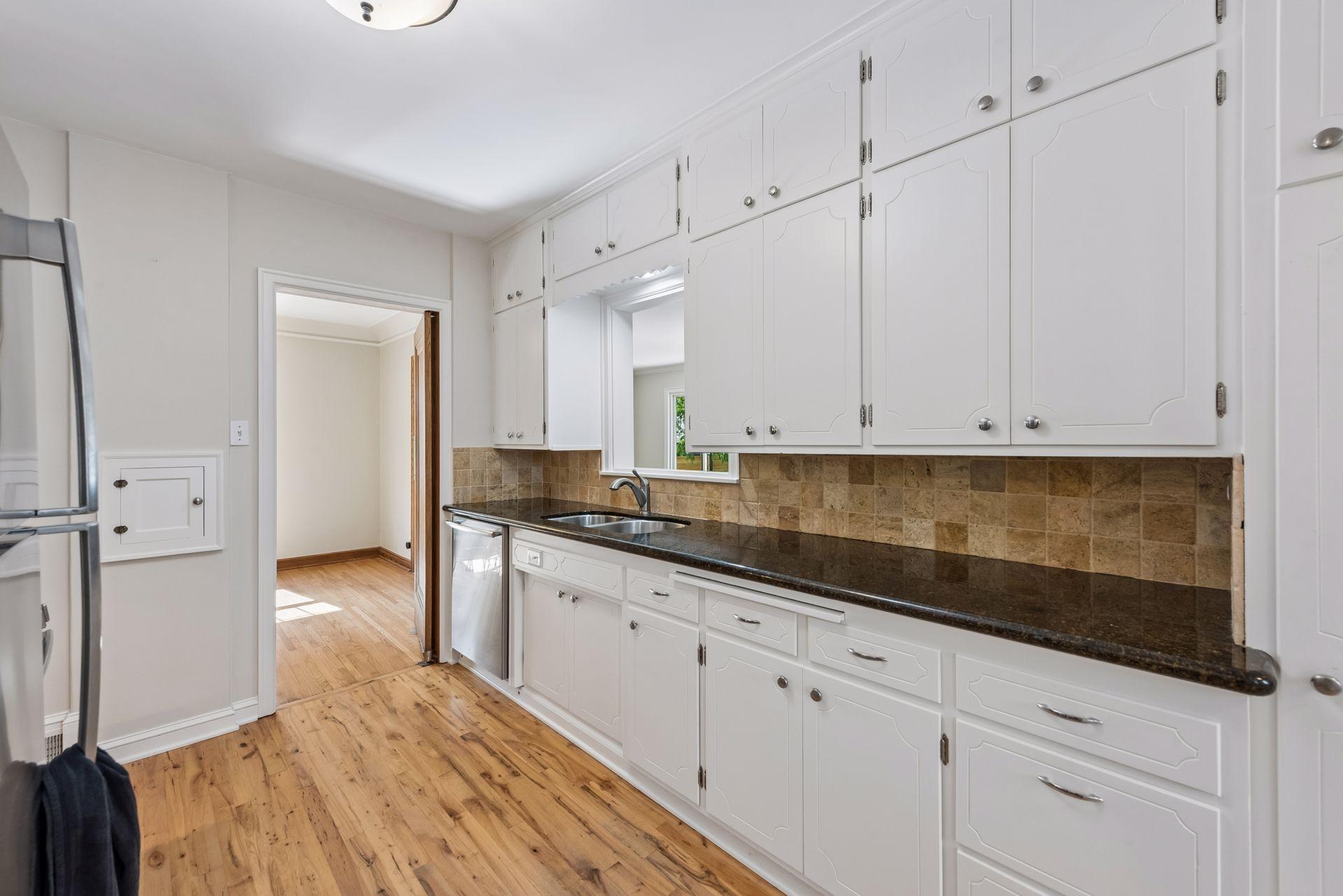 Natural wood flooring and a dishwasher