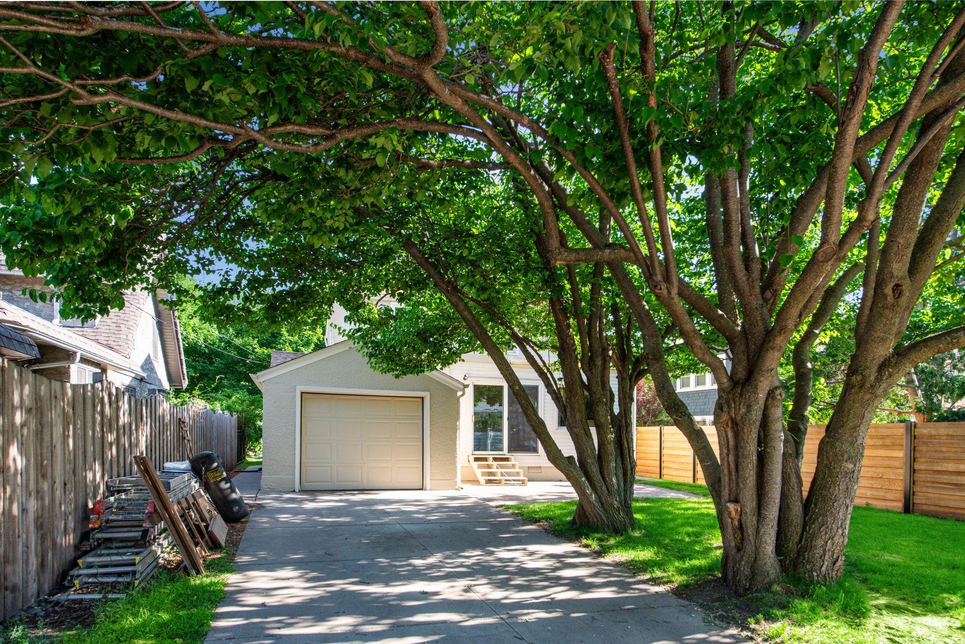Single car garage with newer cement driveway