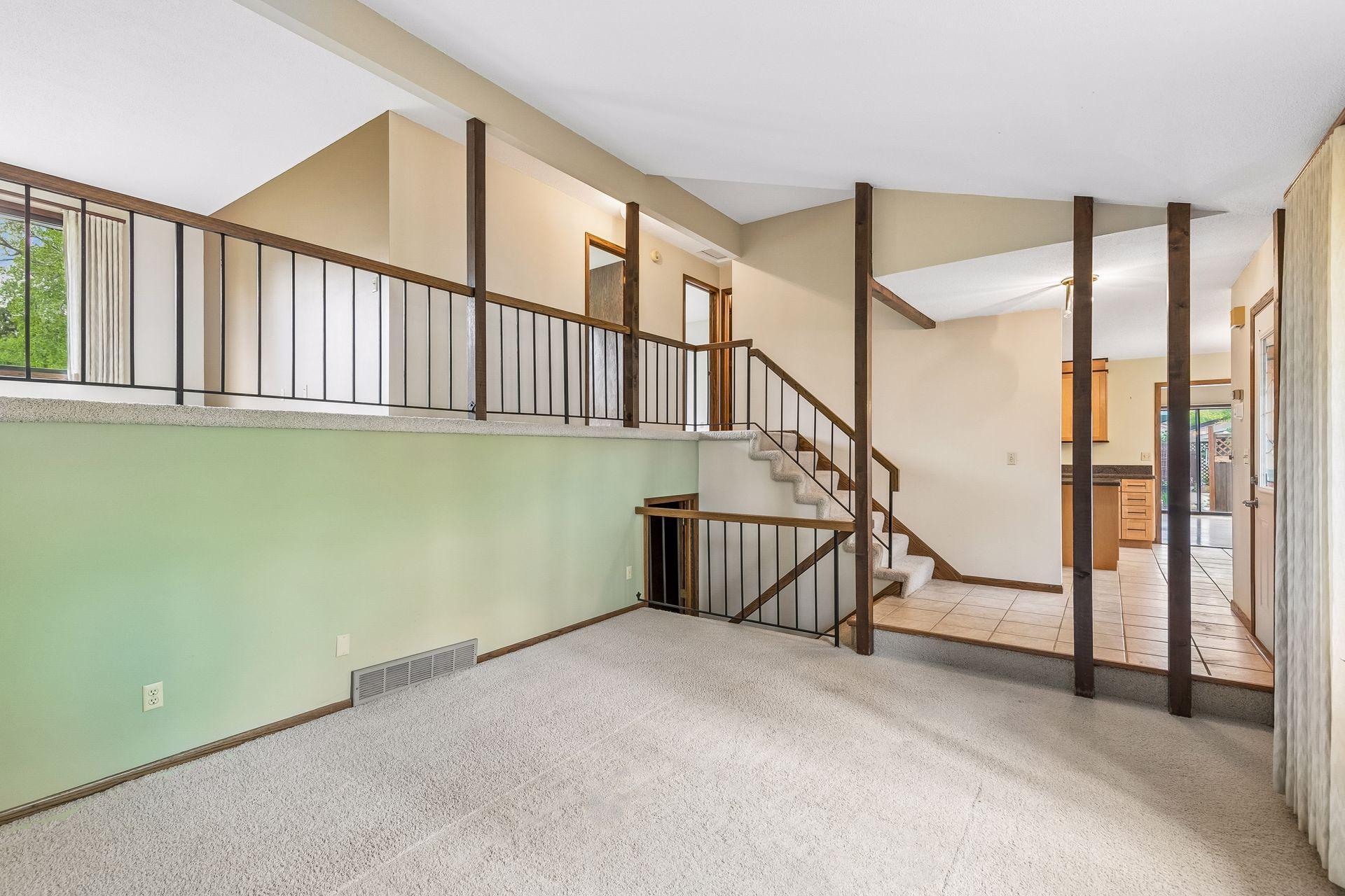 Main level living space w/ view of loft