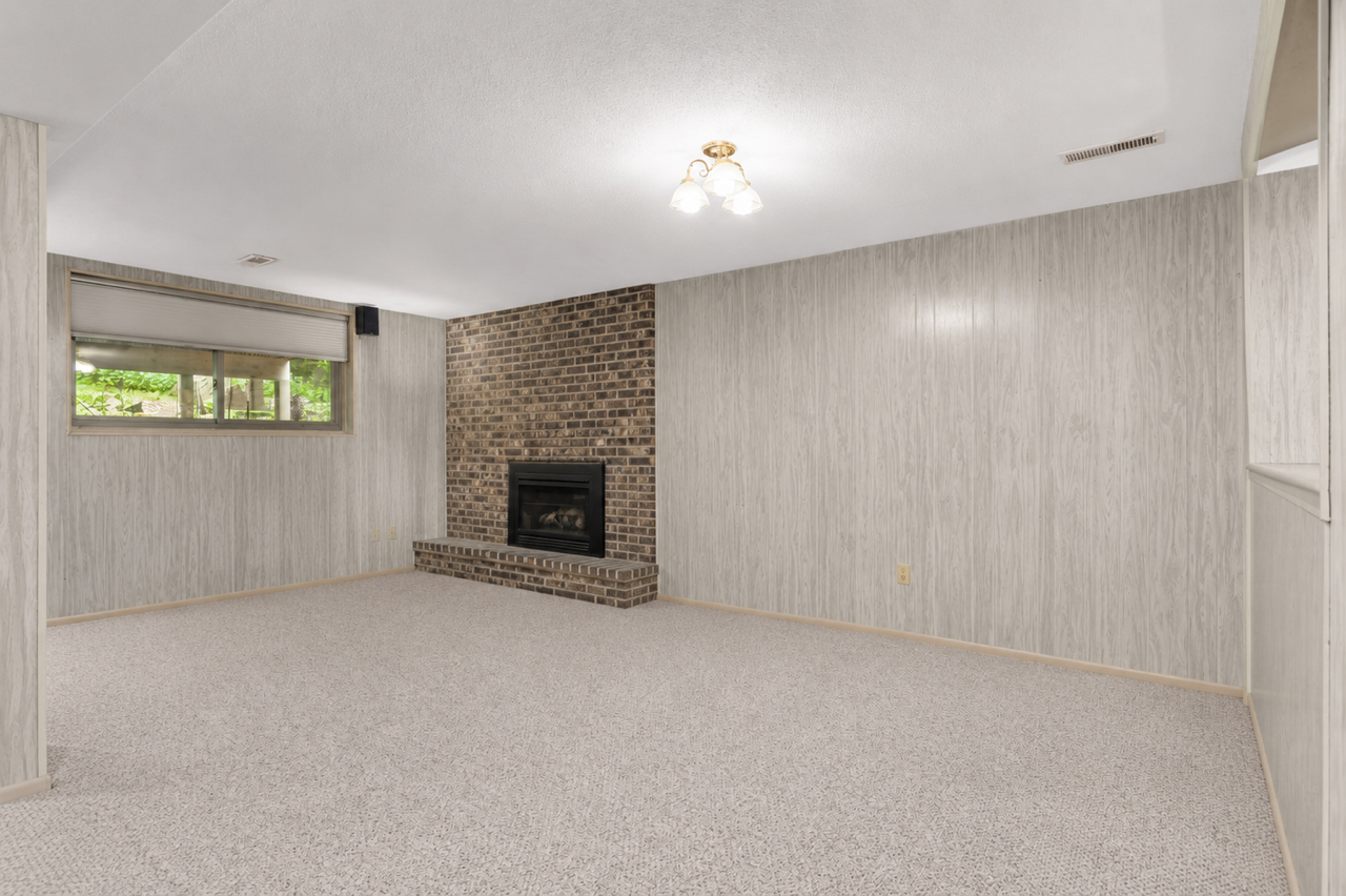 Large lookout windows allow for natural light to flow throughout the lower level.