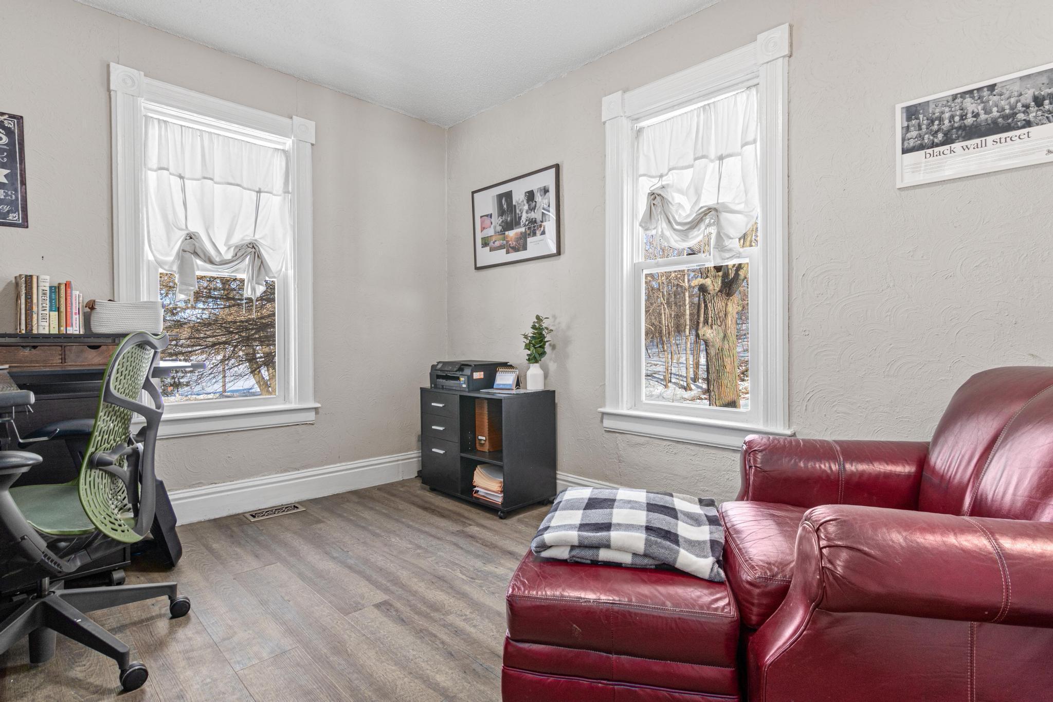 A flexible main-level bedroom easily adapts as a guest retreat, home office, or primary suite to fit your lifestyle