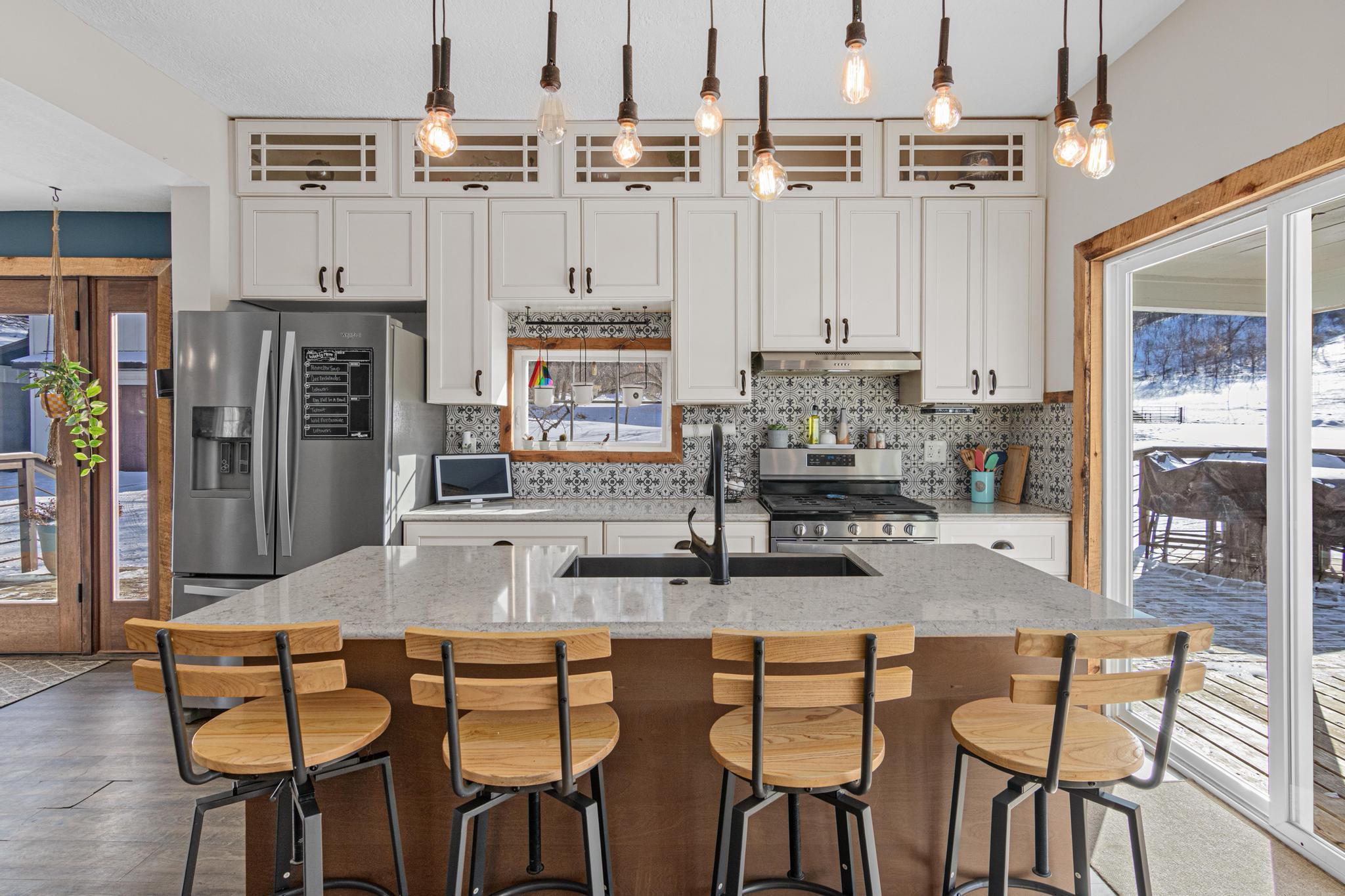 The kitchen invites everyone to pull up a seat