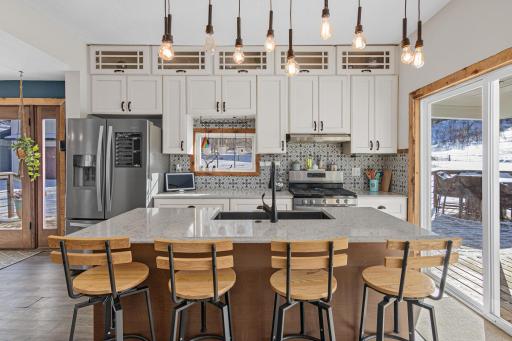 The kitchen invites everyone to pull up a seat