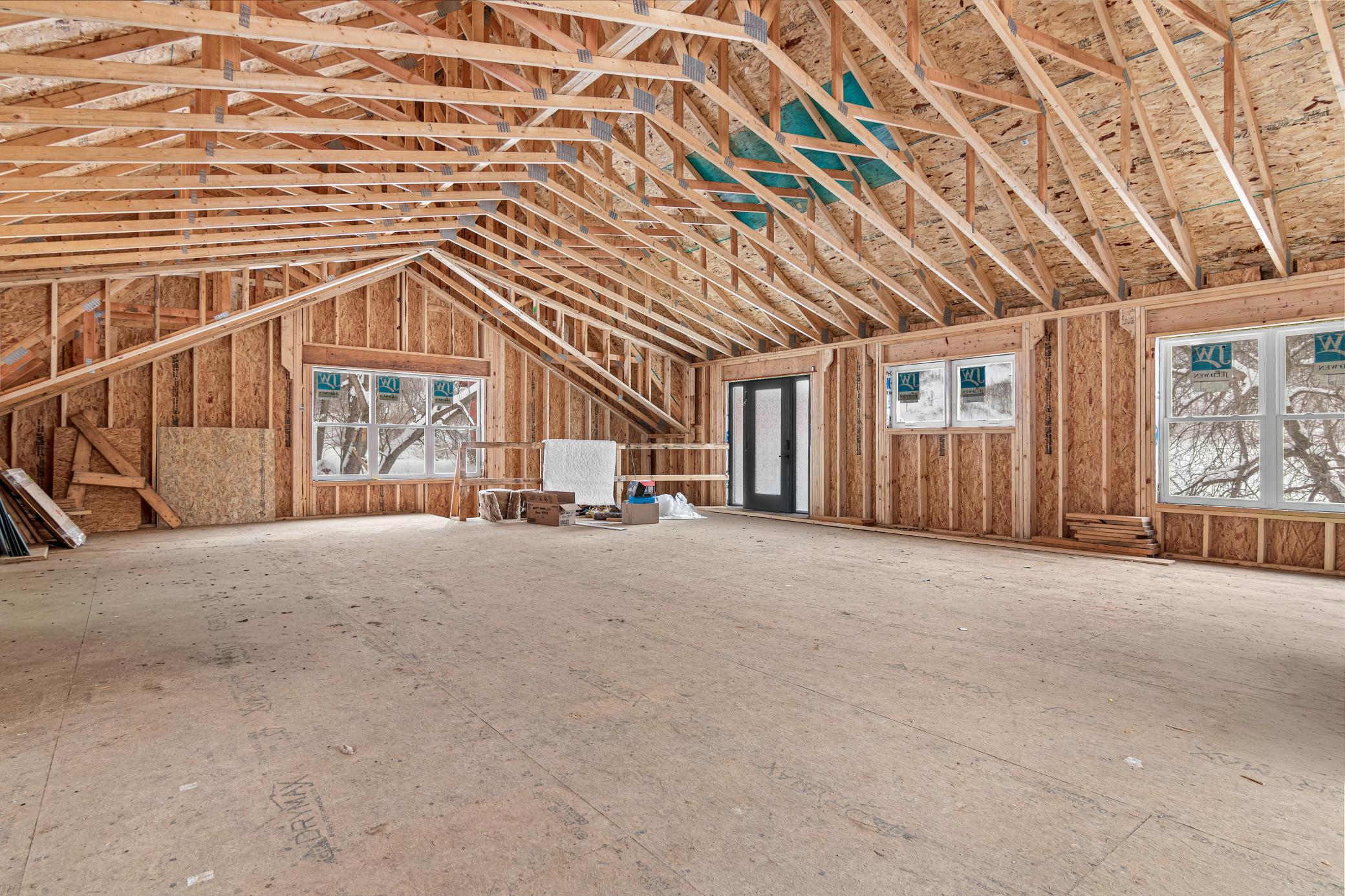 An unfinished upper level filled with opportunity and natural light
