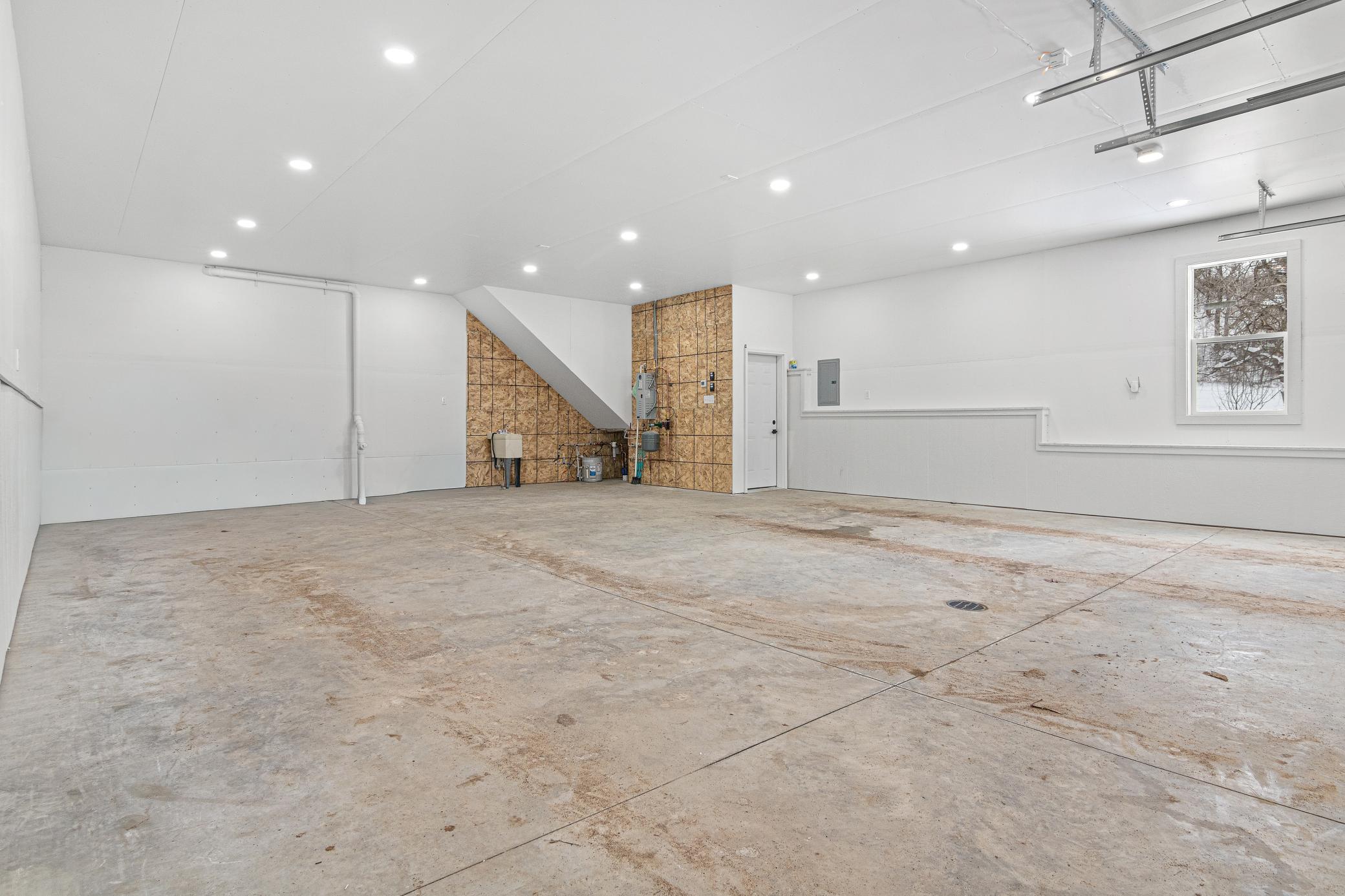 Exceptional garage space with soaring ceilings and endless versatility