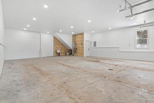 Exceptional garage space with soaring ceilings, in-floor heat, and endless versatility