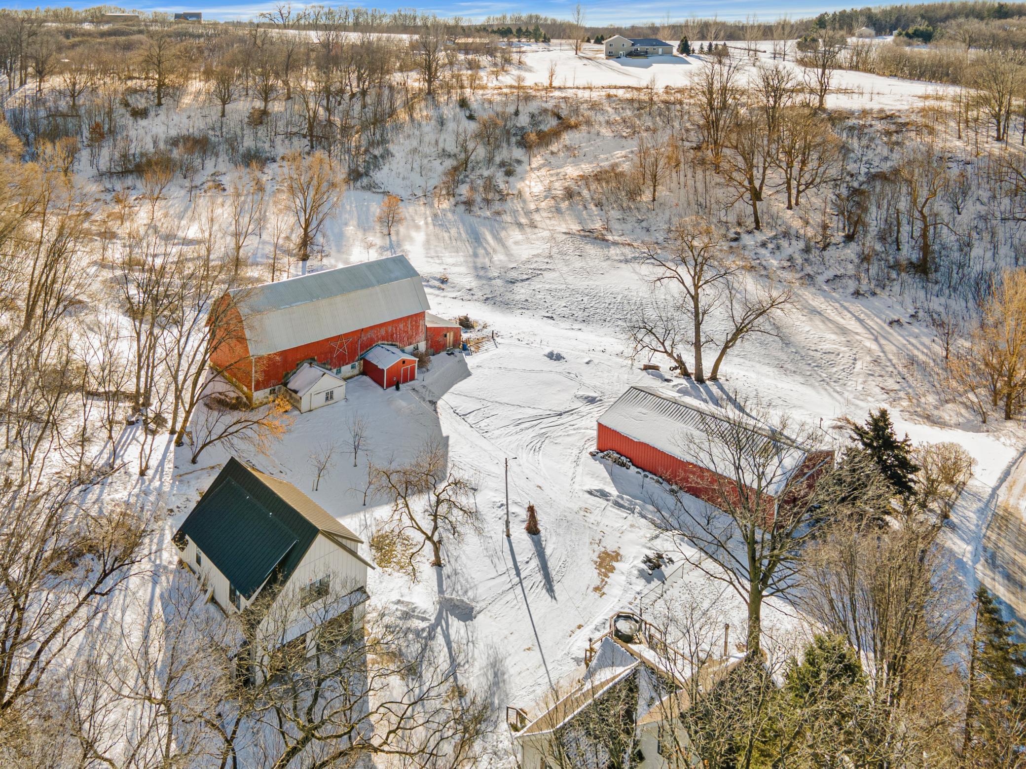 Additional outbuildings provide room for hobbies and equipment