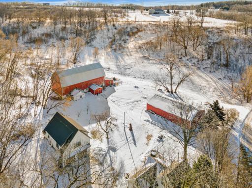 Additional outbuildings provide room for hobbies and equipment