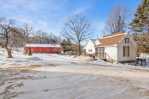 A peaceful homestead setting surrounded by mature trees and open skies