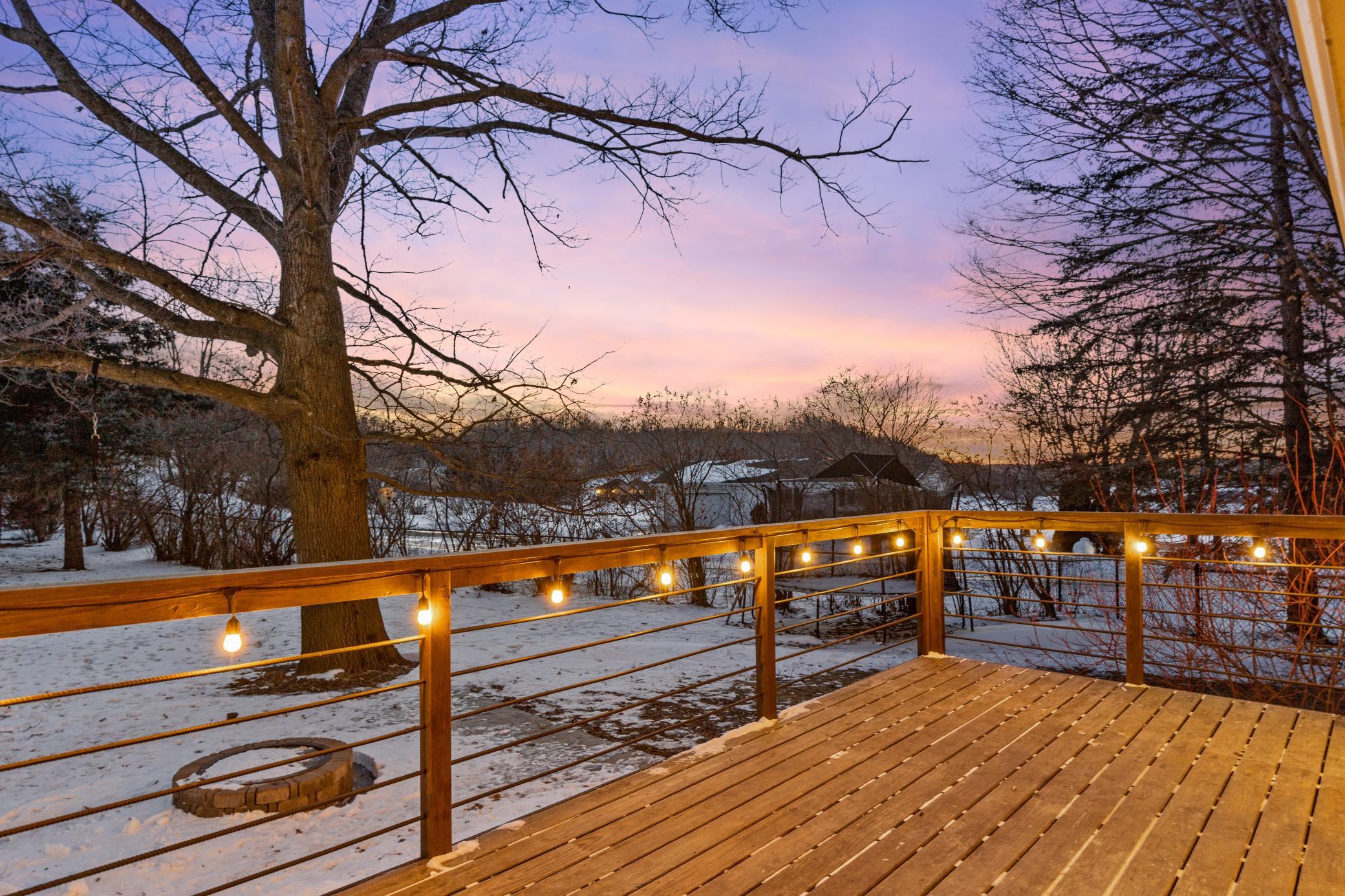 Deck views stretching across the fenced yard and beyond