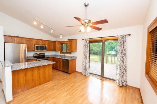 The dining area opens to the expansive back deck, creating an ideal space for everyday living & entertaining.