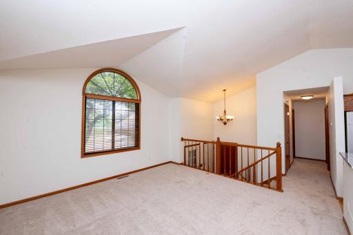 Transom window brings in natural light. Ceiling fans throughout the home to add to the comfort.
