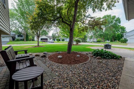 Maintenance free landscaping. Bench and little table stays. No Work here, just bring your bags and move right in.