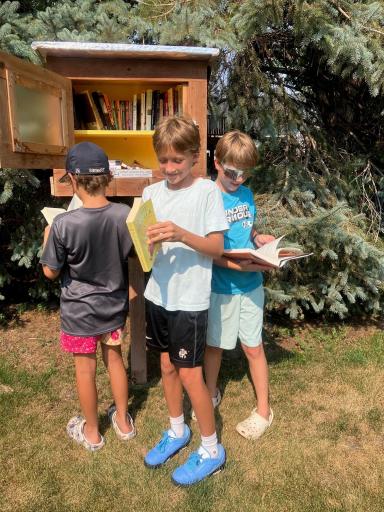 Neighborhood kids enjoying the Little Library. Great Neighborhood