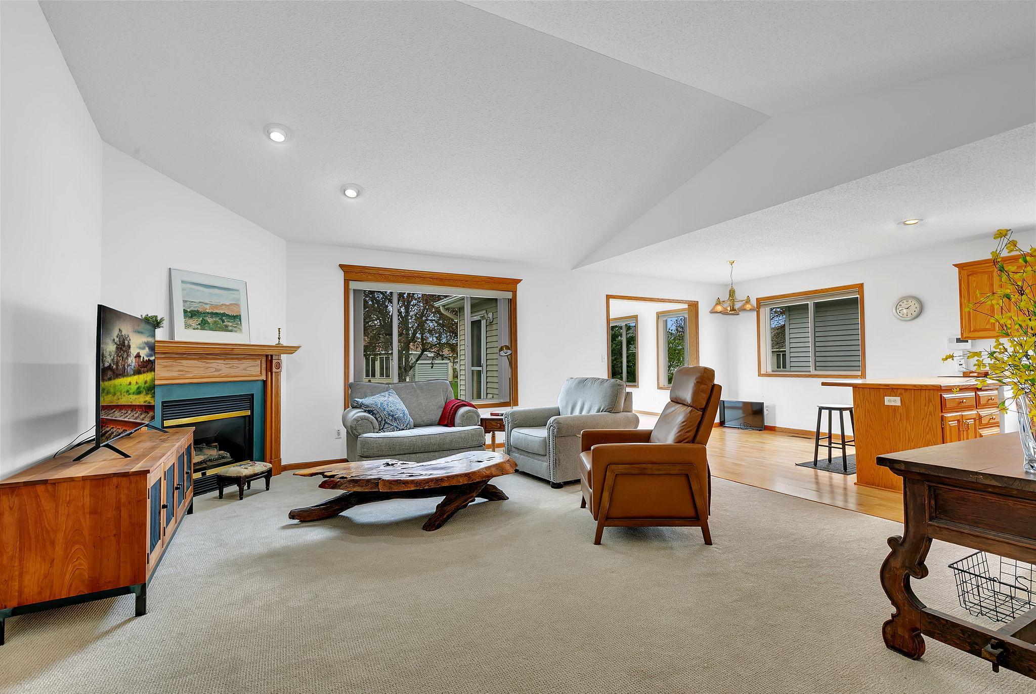 Living Room w/gas fireplace and vaulted ceiling
