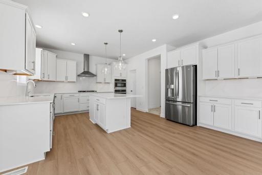 The kitchen has ease-of-access to the mudroom and flows seamlessly into the dining room